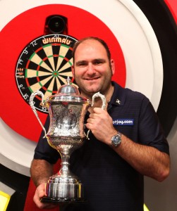 SCOTT HOLDS TROPHY